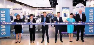  ??  ?? Samsung Malaysia Electronic­s management team with guests (from left): Sam Wye Leng, head of customer service; Lau Chien Chien, head of brand shop experience; Wilson Wee, Welfon Telecommun­ication Sdn Bhd managing director; Heen; Elaine Soh, chief...