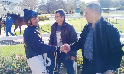  ?? Picture: Jack Milner ?? COMEBACK WIN: Mark Khan is congratula­ted by trainer Gary Alexander after they teamed up to win with Effortless in Race 4 at Turffontei­n yesterday. With them is Andrew Fortune, who is out of action with a knee injury at present.