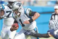  ?? AP PHOTO/MIKE MCCARN ?? The Carolina Panthers’ Cam Newton runs past the Dallas Cowboys’ Jeff Heath during their game last weekend. The Panthers play the Atlanta Falcons on Sunday.