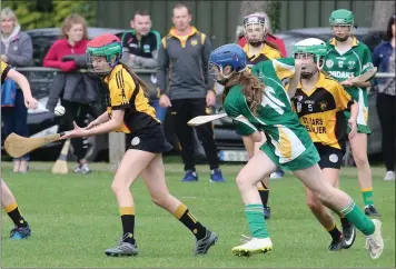  ??  ?? Clara O’Leary of St. Ibar’s/Shelmalier keeps the ball away from Libby Cullen (Duffry Rovers).