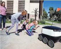  ?? SEAN LOGAN/ THE REPUBLIC ?? A tech firm wants the state to approve a bill that would allow small robots, such as this one seen at the Capitol this week, to deliver food and other goods in Arizona.