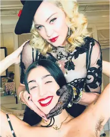  ??  ?? Material girl... Madonna poses with daughter Lourdes, 21