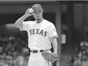  ?? PHOTO] [AP ?? Texas Rangers starting pitcher Yu Darvish was traded to the Los Angeles Dodgers during the final minutes of the Major League Baseball trade deadline Monday.