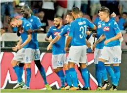  ??  ?? Napoli’s Jorginho (left) celebrates with teammates after scoring against Nice in their Champions League play-off first leg in Paris on Wednesday. Napoli won 2-0. — AFP