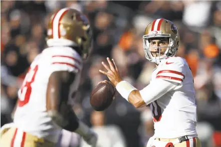  ?? Joe Robbins / Getty Images ?? Jimmy Garoppolo was 14-for-14 passing when he targeted his top two receivers in his first start for the 49ers on Sunday.