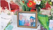 ?? AP/THE NEWS & OBSERVER, CHRIS SEWARD ?? A makeshift memorial shows three Muslim Americans shot dead on Tuesday: Deah Shaddy Barakat, 23; Yusor Mohammad, 21; and Razan Mohammad AbuSalha, 19.