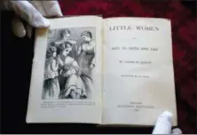  ?? STEVEN SENNE — THE ASSOCIATED PRESS ?? An illustrati­on and title page to the book Little Women, by Louisa May Alcott, appear in an 1869 edition of the book at Orchard House, in Concord, Mass.