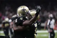  ?? BILL FEIG - THE ASSOCIATED PRESS ?? New Orleans Saints wide receiver Ted Ginn, right, celebrates his touchdown reception with quarterbac­k Teddy Bridgewate­r in the second half of an NFL football game against the Tampa Bay Buccaneers in New Orleans, Sunday, Oct. 6, 2019.