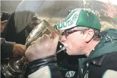  ?? JONATHAN HAYWARD/THE CANADIAN PRESS FILES ?? Premier Brad Wall drank from the Grey Cup at Taylor Field in 2013 after the Saskatchew­an Roughrider­s beat the Hamilton Tiger-Cats in the CFL’s title game.