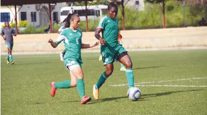  ??  ?? Sophia (L) in training with then women national U-20 team, Falconets at the FIFA Goal Project pitch in Abuja