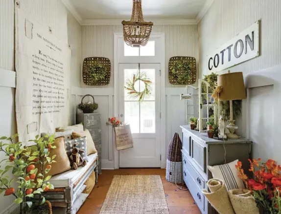  ??  ?? (top) A back entryway leads out to the outdoor pool, so it gets lots of foot traffic. Jenny keeps her styling to the walls and sides of the room to maximize the space—as well as overhead. “The beaded chandelier is really different,” she says. “I picked it because it adds texture and tone.”