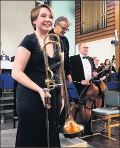  ??  ?? Trombone soloist, Rhiannon Symonds, at the Loughborou­gh Orchestra concert. Photo by J Welbourn.