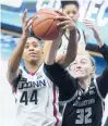  ?? DAVID BUTLER II/AP ?? UConn forward Aubrey Griffin (44) works for the ball against Georgetown forward Taylor Baur (32) in the first half Satureday in Storrs.