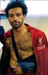  ?? ?? Pain game: Salah spent the evening with his left arm in a sling