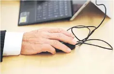  ??  ?? Yasuhiro Furuse, a senior adviser of corporate sales headquarte­rs of Orix Corp, uses his laptop at a meeting room in Tokyo, Japan. – Reuters photo