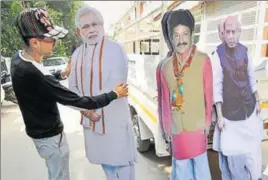  ?? PARDEEP PANDIT/HT ?? A worker with cutouts of PM Narendra Modi, BJP’s Gurdaspur candidate Swaran Salaria and Union home minister Rajnath Singh, outside a printer’s shop in Jalandhar on Thursday.