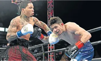  ?? Picture: GETTY IMAGES/ JAYNE KAMIN-ONCEA ?? BLOWN AWAY: Gervonta Davis, left, connects to the head of Hugo Ruiz with a left to the head during their WBA Super Featherwei­ght Championsh­ip fight which was held in Carson, Southern California on Saturday.