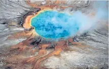  ?? Photo: REUTERS ?? The Grand Prismatic hot spring merely hints at the power of molten rock under Yellowston­e National Park, according to a new study.