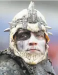  ?? Brett Carlsen / Getty Images ?? A Raiders fan dressed for a party, but had little to celebrate during the game in New York.