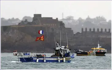  ??  ?? STORMY WATERS: French boats set up a blockade of St Helier in a dispute over fishing licences