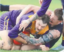  ?? ?? Thomson’s Daniel Freeman is tackled by Winchelsea’s Riley Berg. Picture: Mark Wilson