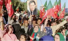  ?? AP ?? Supporters of former Pakistani Prime Minister Imran Khan’s party stage a protest in Karachi on Friday to condemn a shooting incident on their leader’s convoy.