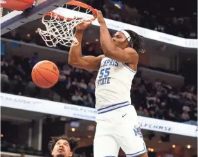  ?? JOE RONDONE/THE COMMERCIAL APPEAL ?? Memphis Tigers forward Precious Achiuwa dunks the ball against the Wichita State Shockers during their game at the Fedexforum on Thursday.