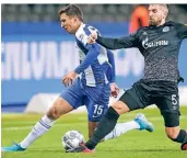  ?? FOTO: DPA ?? Paarlauf im Olympiasta­dion: Der Berliner Marko Grujic (links) und der Schalker Matija Nastasic bemühen sich um den Ball.