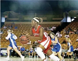  ?? [PHOTOS BY MORGAN HORNSBY/TULSA WORLD] ?? Maia Wright of Luther dribbles the ball at the small schools All-State basketball game in Tulsa on Wednesday.