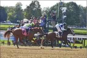  ?? DAVID M. JOHNSON - DJOHNSON@DIGITALFIR­STMEDIA.COM ?? Hazit (2), with John Velazquez up broke his maiden over Good Magic (8) to open the Travers Day cart Saturday at Saratoga Race Course.