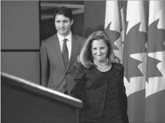  ?? CP PHOTO ?? Prime Minister Justin Trudeau and Minister of Foreign Affairs Chrystia Freeland arrive to hold a press conference regarding the United States Mexico Canada Agreement (USMCA) at the National Press Theatre, in Ottawa on Monday.