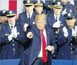  ?? Justin Lane European Pressphoto Agency ?? PRESIDENT TRUMP’S comments about how to handle individual­s in police custody quickly reverberat­ed across law enforcemen­t circles and social media.