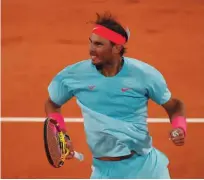  ??  ?? Rafael Nadal se je sredi noči razveselil uvrstitve v polfinale.
