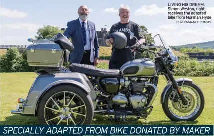  ?? PERFORMANC­E COMMS ?? LIVING HIS DREAM: Simon Weston, right, receives the adapted bike from Norman Hyde