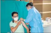  ?? MANOJ DHAKA/HT ?? A medical profession­al administer­s Covid vaccine to a beneficiar­y at PGIMS, Rohtak.