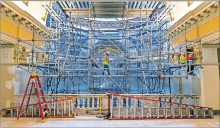  ?? [CHRIS LANDSBERGE­R PHOTO/THE OKLAHOMAN] ?? Scaffoldin­g fills the rotunda as crews continue restoratio­n this month at the state Capitol in Oklahoma City.