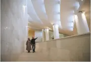  ?? Vahid Salemi / Associated Press ?? Catherine Spiridonof­f (left) and her husband, Reza Daneshmir, designed Tehran’s Vali-e-Asr mosque.