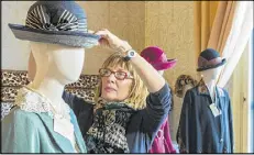  ?? JOHN WARNER / THE BILTMORE COMPANY ?? Mannequins needed to be created to match individual actors’ and actresses’ dimensions. EDG consultant Nancy Lawson adjusts a hat.