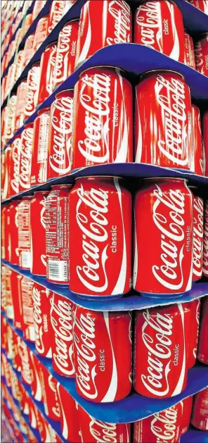  ?? George Frey, Blomberg News, file ?? Coca-cola Co. is changing its manufactur­ing to avoid a cancer warning on cans. The company doesn’t know when the change will be implemente­d in Canada.
