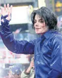  ??  ?? In this 2001 file photo, Michael Jackson waves to crowds gathered to see him at his first-ever in-store appearance to celebrate his new album, ‘Invincible’ in New York.