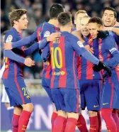  ?? — AFP ?? Barcelona players celebrate after Neymar scored against Real Sociedad in San Sebastian.