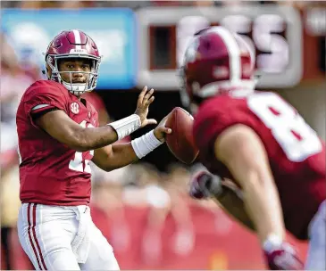  ?? WESLEY HITT / GETTY IMAGES ?? Alabama QB Tua Tagovailoa looks to throw to tight end Hale Hentges in the second quarter against Texas A&amp;M on Saturday. Tagovailoa and Hentges would connect for two TDs in the Tide’s 45-23 win.