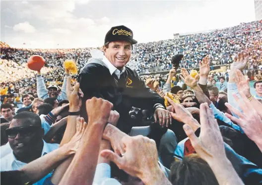  ?? Cliff Grasmick, Daily Camera file ?? Colorado football coach Bill McCartney is carried off the field after a 27-21 win over Nebraska on Nov. 4, 1989, at Folsom Field.