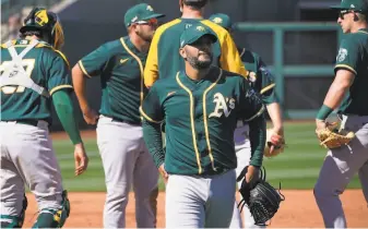  ?? Photos by Sue Ogrocki / Associated Press ?? A’s righthande­r Yusmeiro Petit had a rough outing, but manager Bob Melvin wasn’t concerned.