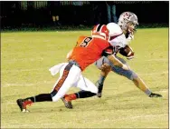  ?? MARK HUMPHREY ENTERPRISE-LEADER ?? Farmington junior Javan Jowers fought through a wide receiver’s block to make an open-field tackle on a screen pass to the flank, a play he had to make more than once against Morrilton. The Cardinals lost 48-6 at home Friday.