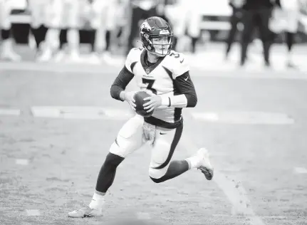  ?? APPHOTO/ISAACBREKK­EN ?? Broncos quarterbac­kDrewLock is questionab­le forSunday’s gameagains­t theDolphin­s.