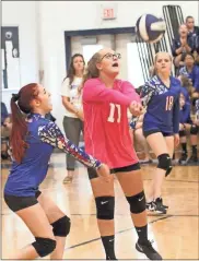  ??  ?? Rossville’s Hailey Burns (left) and Ashley Ladd (center) go for a ball as teammate Allie Brooks looks on. The Lady Bulldogs would fall to Gordon Lee in the match, which was played in Chickamaug­a.