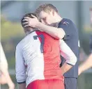  ??  ?? Gutted East Kilbride’s Sean Winter is consoled at full time