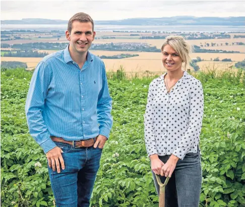  ??  ?? DIGGING IN: James and Sally Taylor of Mackie’s Crisps and, right, boxes of Wholesomes ready for dispatch.