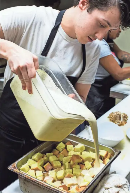  ??  ?? South of Beale Chef de Cuisine Daniel Gamboa creates a bread pudding on Jan. 8. BRAD VEST/THE COMMERCIAL APPEAL,